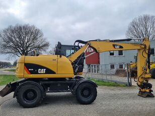 escavatore gommato Caterpillar M313D